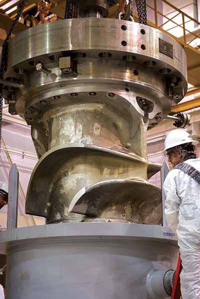 The refurbished pump is placed in the cask.