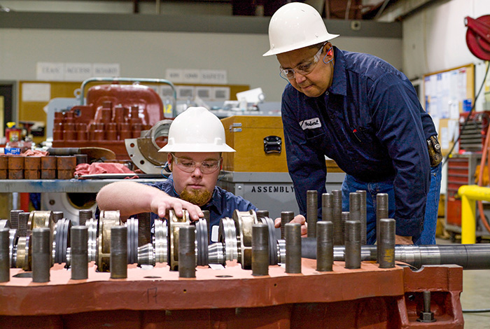 workers fixing impeller