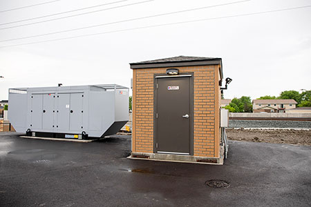 IMAGE 2: Prefabricated control building and generator