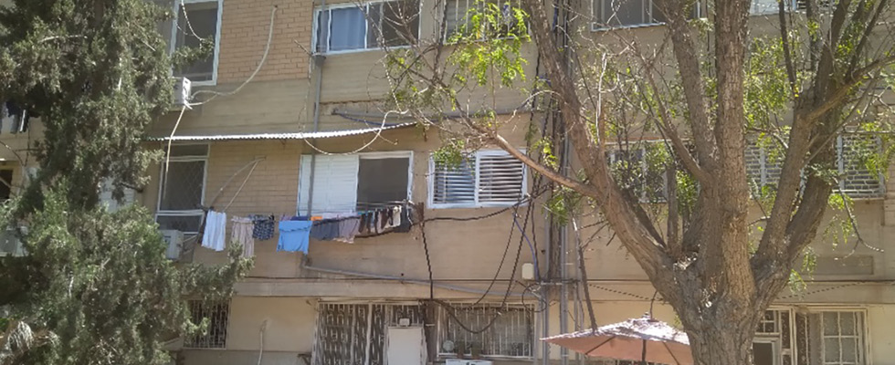 IMAGE 1: Apartment building with original  watering connection at a ground floor (Images courtesy of the author)