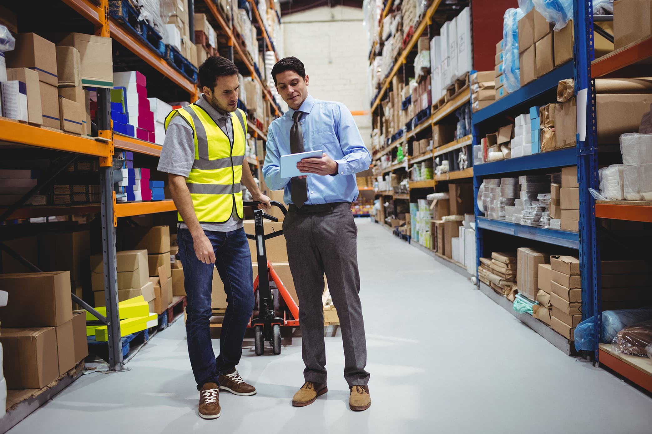 Manager and worker in a warehouse