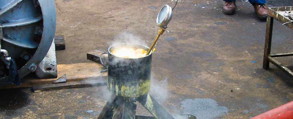 Submerging a bearing in an oil bath 